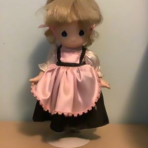 Precious Moments doll with display stand.